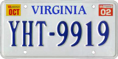 A white Virginia plate with blue letters and a 2002 sticker